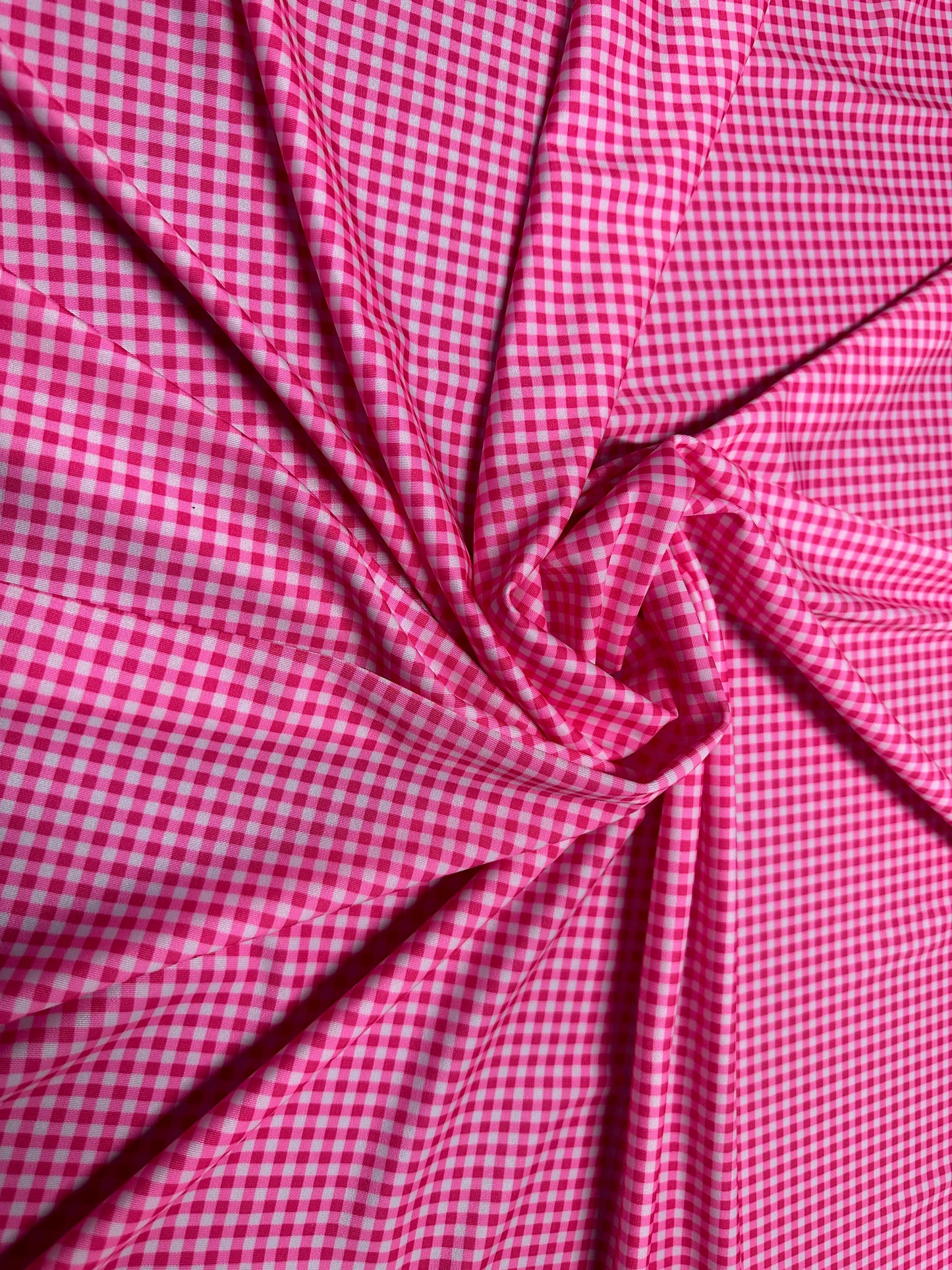 Gingham design 1/4” Hot pink color print on great quality of nylon spandex 4-way stretch 58/60”