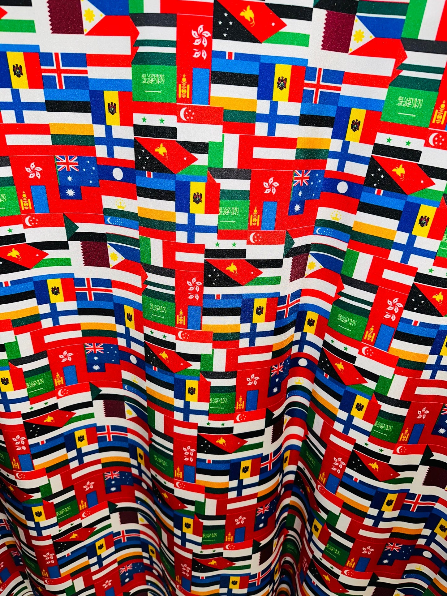 Nations flags design print on great quality of nylon spandex 4-way stretch 58/60” Sold by the YD.