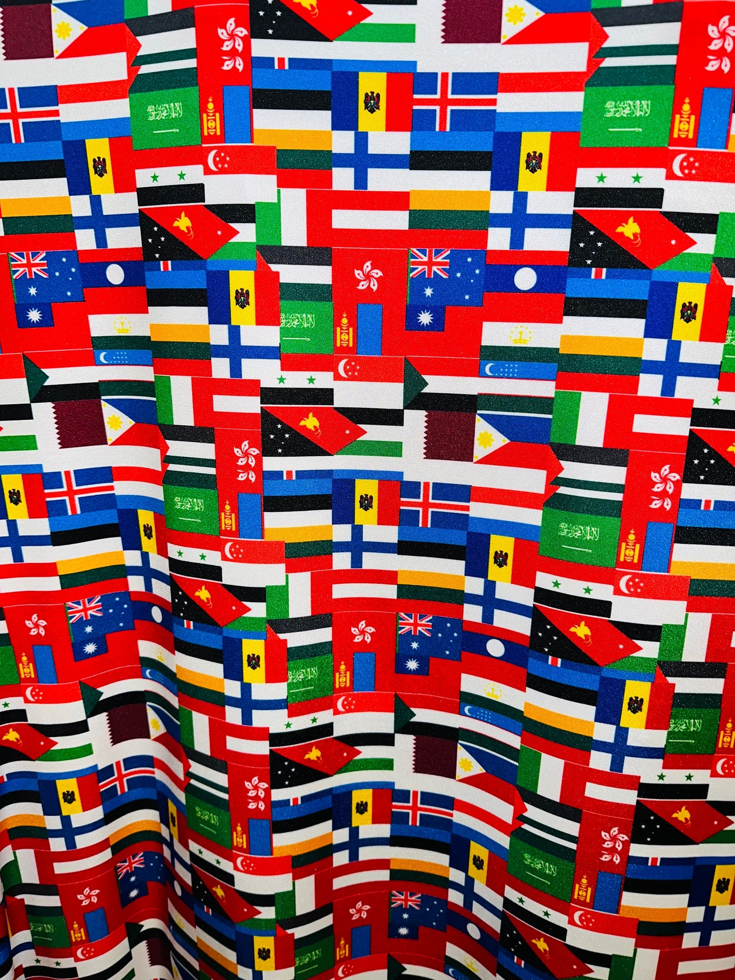 Nations flags design print on great quality of nylon spandex 4-way stretch 58/60” Sold by the YD.