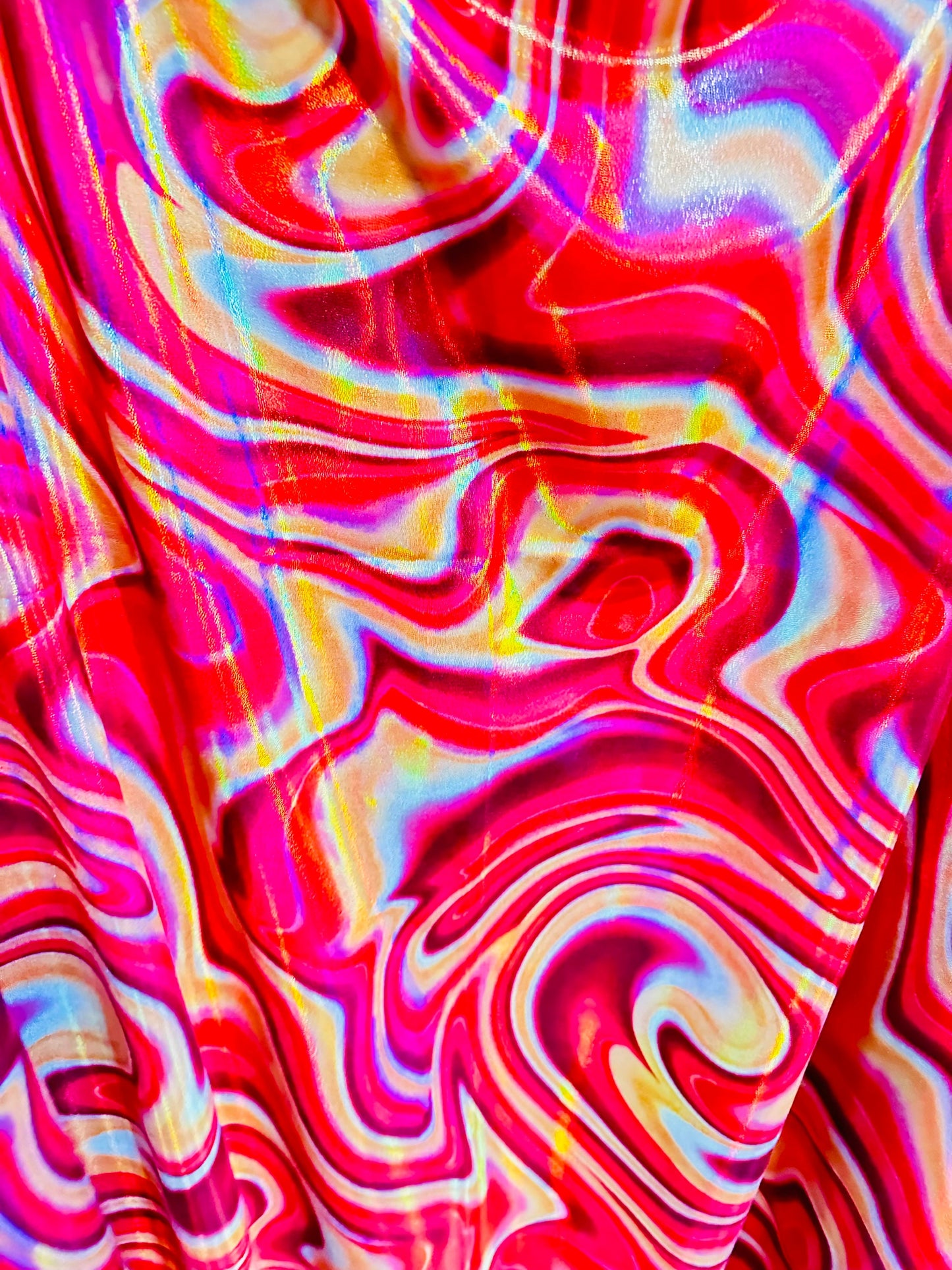 New Modern abstract lava design on Iridescent metallic nylon spandex 4-way stretch 58/60” Sold by the YD.