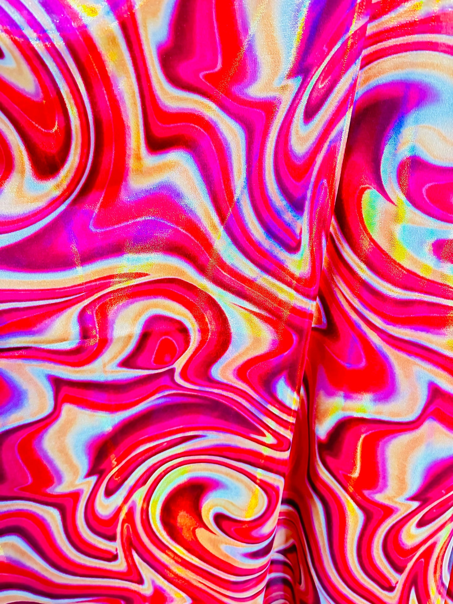 New Modern abstract lava design on Iridescent metallic nylon spandex 4-way stretch 58/60” Sold by the YD.